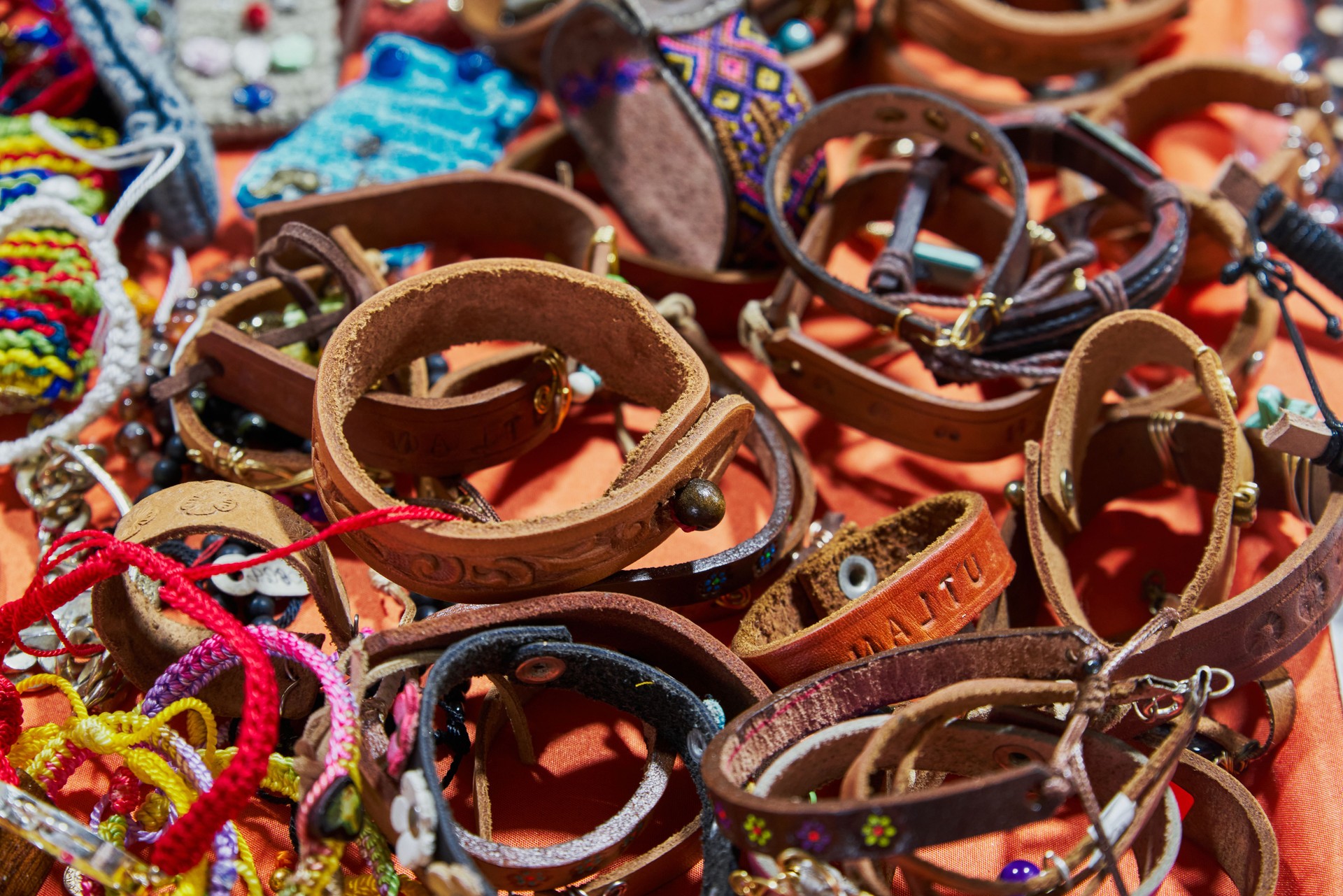 Handmade bracelets made of leather and thread