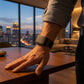 Ecoband 5.0 in Black & Orange — on the wrist (black & orange)