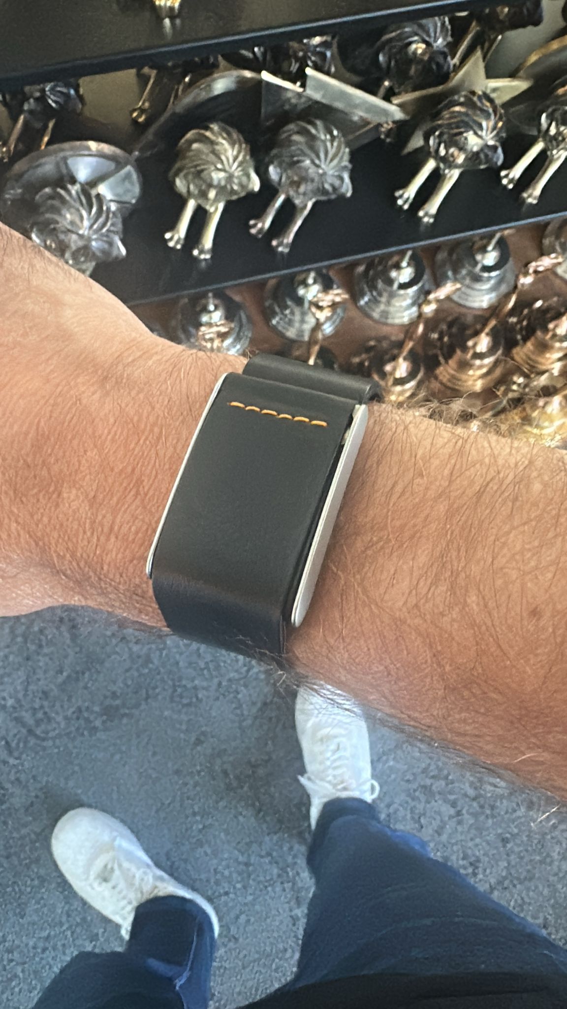 Rocker Duck Ecoband in Black & Orange with contrast stitching and steel clasp, worn on the wrist