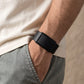 Ecoband 5.0 in Black with black clasp, close-up with hand in pocket (black)