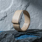 Ecoband 5.0 in Sand — Italian bio-leather WHOOP band with brushed silver clasp, on black stone (Sand)