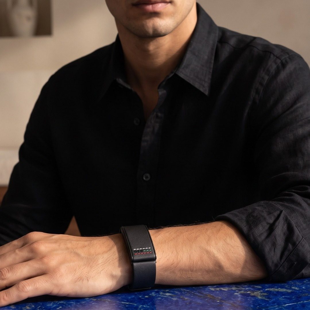 Ecoband 5.0 Roots in UAE Flag worn with a black shirt, resting on lapis lazuli (UAE Flag)